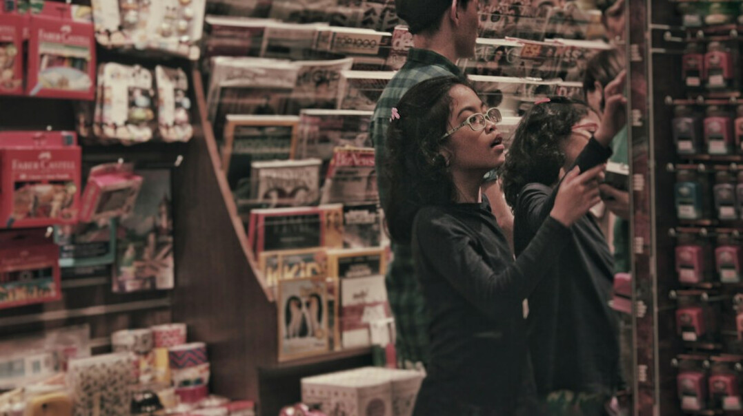 store detective observing shoppers