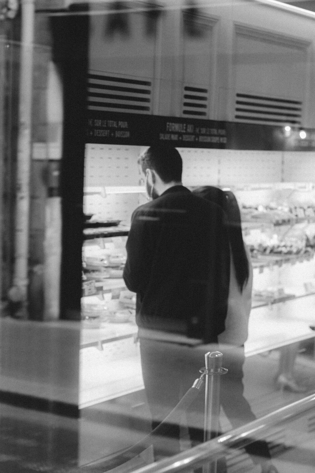 man with backpack in store