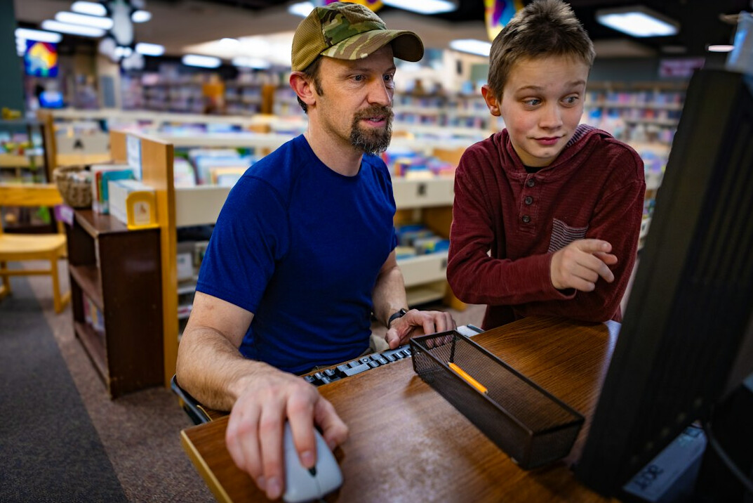 store employee assisting customer